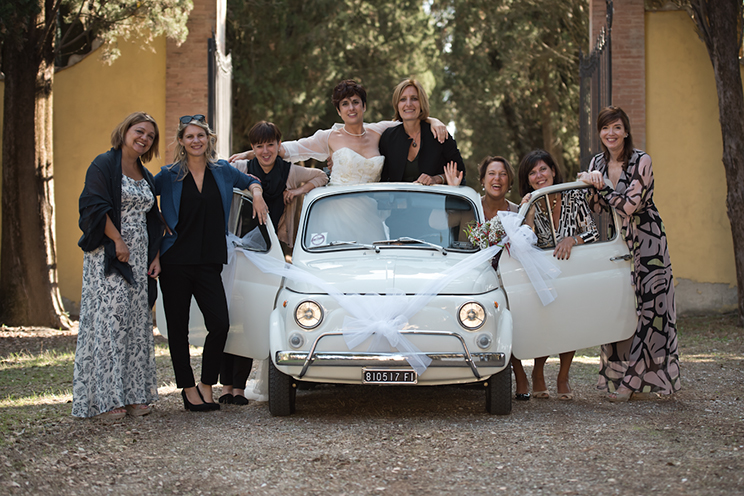 # The bride and all her hystorical friends with an old original FIAT 500.