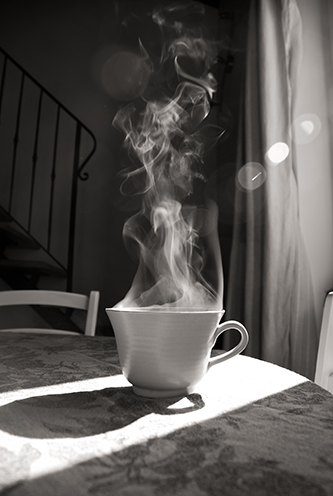 GETTING READY: # Still life photograph of a smoking tea cup, the morning of the wedding.